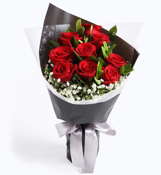 9 Corolla red roses, 5 gardenia leaves, 2 baby's breath